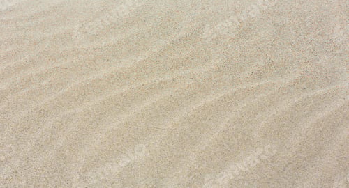 Preview: White Sand Background With Barely Visible Waves After Surf On Beach.