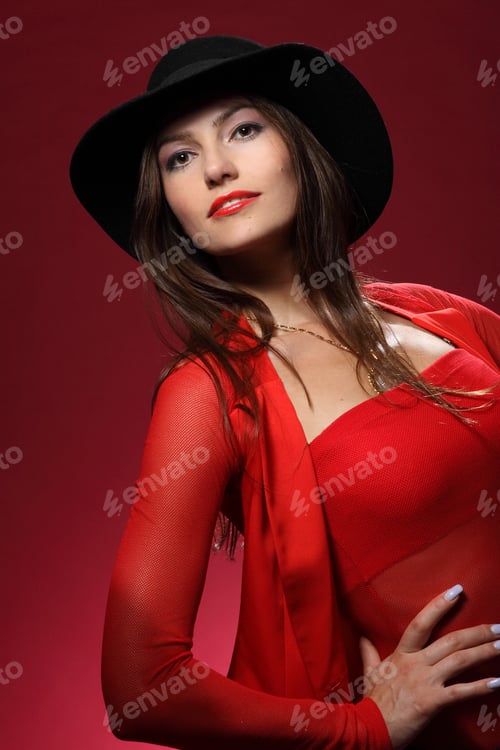 Preview: Beautiful Woman In A Hat On A Red Background. Flirty Look. Game Emotions.