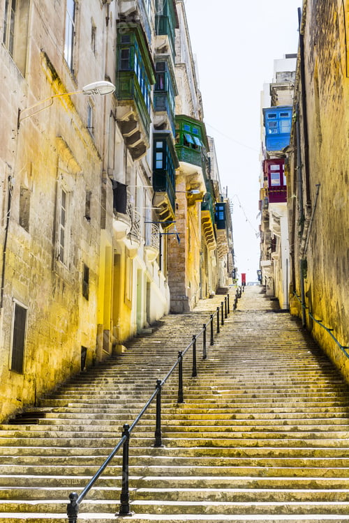 Preview: Typical Narrow Street With Stairs On The Island Of Malta. Buildings With Traditional Colorful