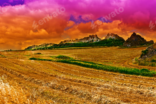 Preview: Mown Wheat Field On The Hills In Sicily At Sunset