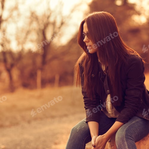 Preview: Beautiful Female Model At Sunset. Wearing Sunglasses. Outdoor Portrait