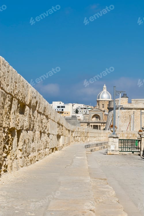 Preview: Narrow Street Along The Wall Of Fortress On The Island Of Malta In Historical Part Of Valletta.