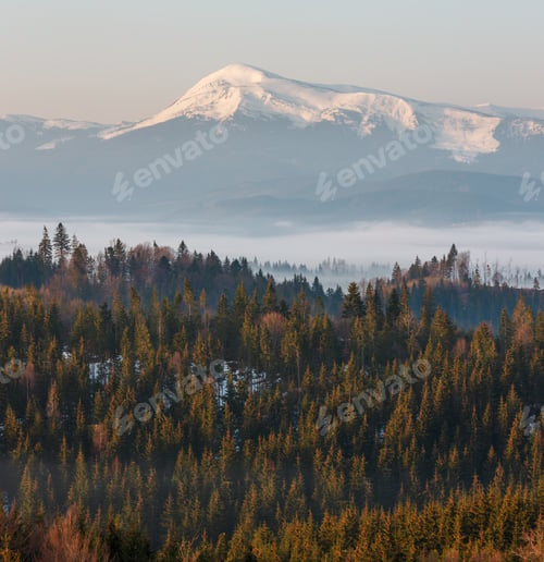 Preview: Early Morning Spring Carpathian Mountains Plateau Landscape With Snow-Covered Ridge Tops In Far