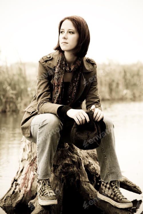 Preview: Girl Sitting At Stub In Water. Photo In Vintage Style.