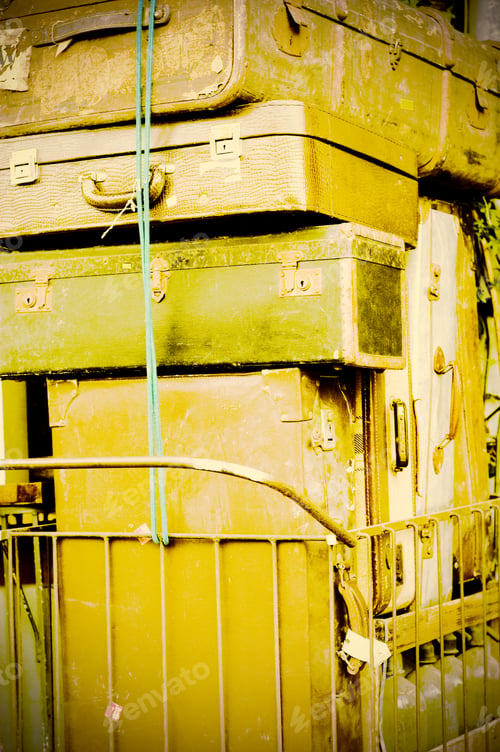 Preview: Pile Of Old Leather Suitcases On A Rusty Cart. Retro Style.
