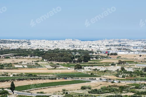 Preview: Rural Landscape With Asphalt Roads And Fields On Malta. Maltese City On The Background Of