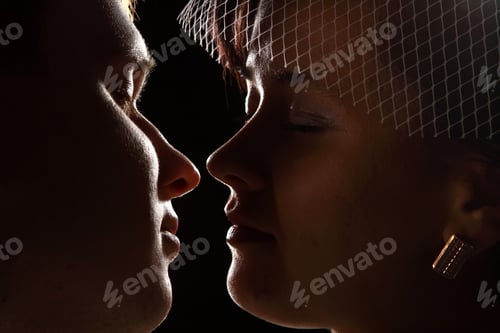 Preview: Loving Couple In A Kiss Against A Dark Background. Love. Family
