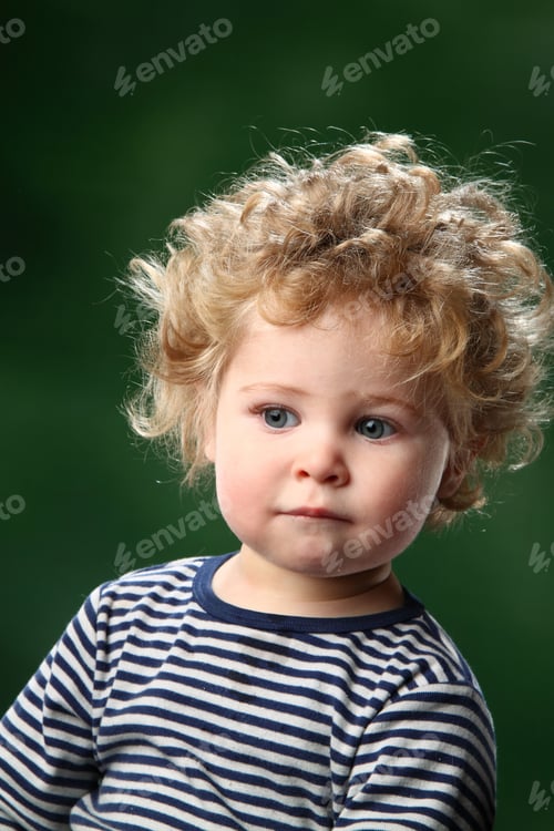 Preview: Portrait Of A Beautiful Little Boy With Curly Hair
