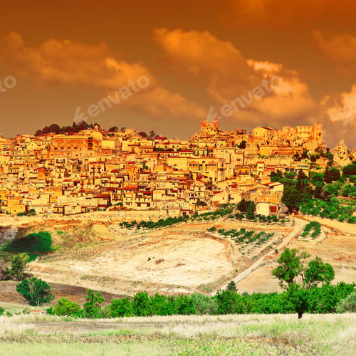 Preview: View To The Medieval City Of Pietraperria In Sicily At Sunset
