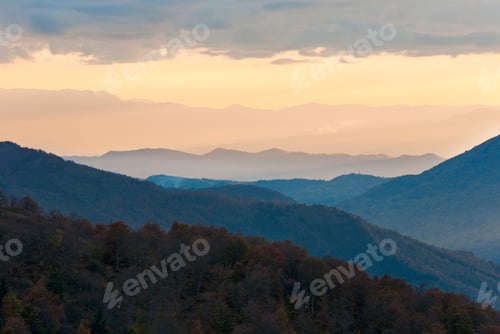 Preview: Autumn Evening Landscape With Lust Sunlight On Mountains And Glow In Sky