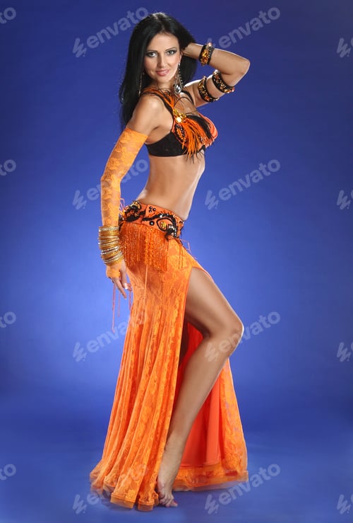Preview: Beautiful Woman Dancing In Colorful Arabic Dance Costume.Girl In An Orange Dress. Beautiful