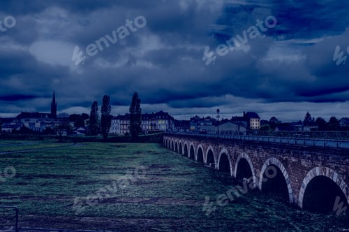 Preview: View On Old Houses And Bridge In City Of Sedan. France In Rainy Day At Night.