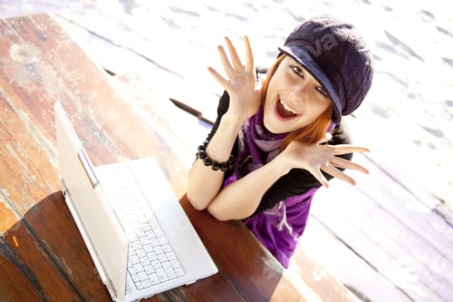 Preview: Portrait Of Red-Haired Girl With Laptop At Beach.