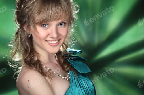 Preview: Portrait Of Beautiful Girl With Curly Hair On A Green Background