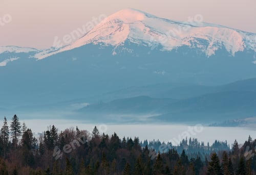 Preview: Early Morning Spring Carpathian Mountains Plateau Landscape With Snow-Covered Ridge Tops In Far