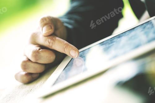 Preview: An Older Man Is Browsing The Internet With A White Tablet Outdoor. Image Has A Vintage Effect