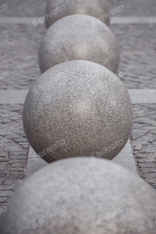 Preview: Row Of Granite Balls On The Pedestrian Sidewalk Paved With Stone Tiles, Cityscape Urban Street