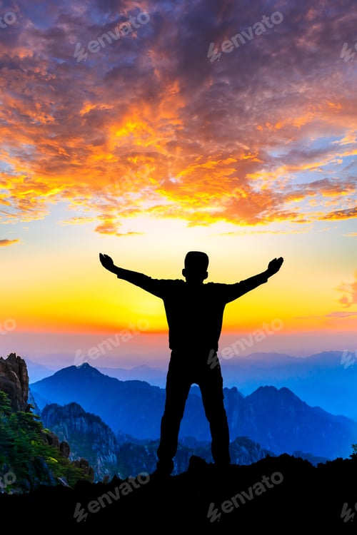 Preview: Young Man Standing In The Summer Mountains At Sunrise And Enjoying View Of Nature.