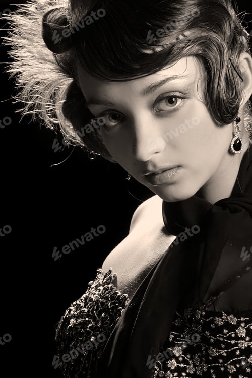 Preview: Portrait Of A Beautiful Brunette On Black Background