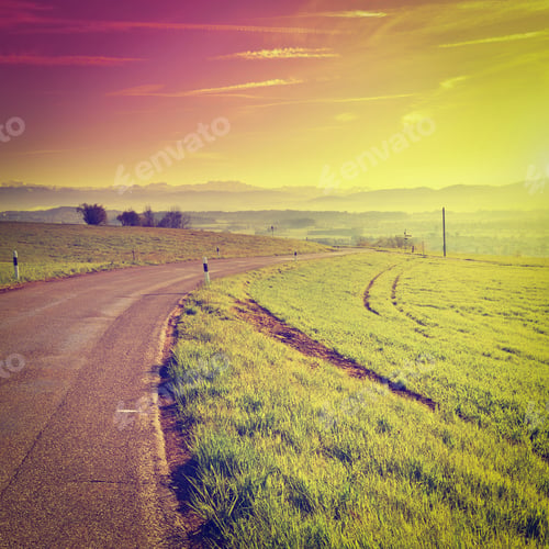 Preview: Asphalt Road On The Background Of Snow-Capped Alps, Sunset In Switzerland, Instagram Effect