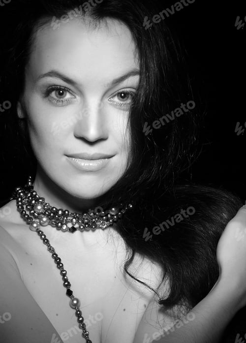 Preview: Portrait Of A Beautiful Brunette On Black Background