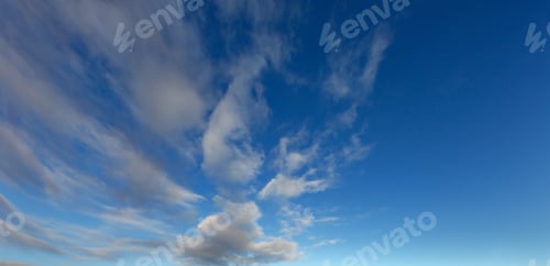 Preview: White Fluffy Clouds In The Blue Azure Sky. Summer Good Weather Background.