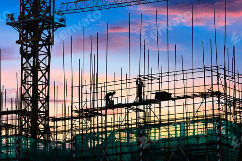 Preview: Construction Site With Crane And Workers At Sunset