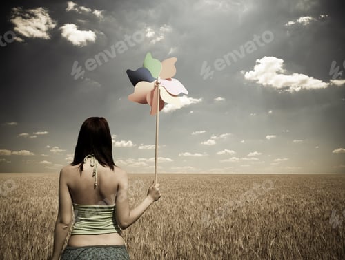 Preview: Girl With Wind Turbine At Wheat Field. Photo In Vintage Style