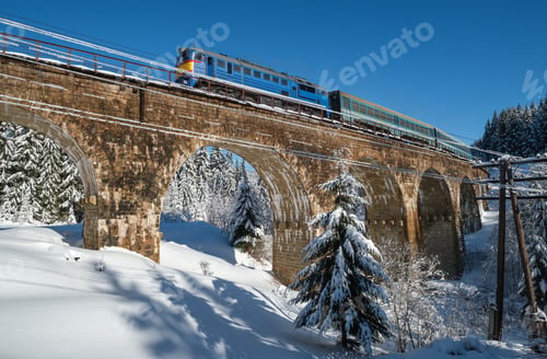 Preview: Stone Viaduct (Arch Bridge) On Railway Through Mountain Snowy Fir Forest And Locomotive With A