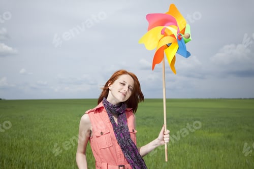 Preview: Girl At Green Wheat Field With Wind Turbine