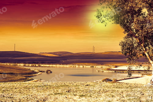 Preview: Pond For Irrigation Between Stubble Fields In Spain After Harvesting At Sunrise. Breathtaking