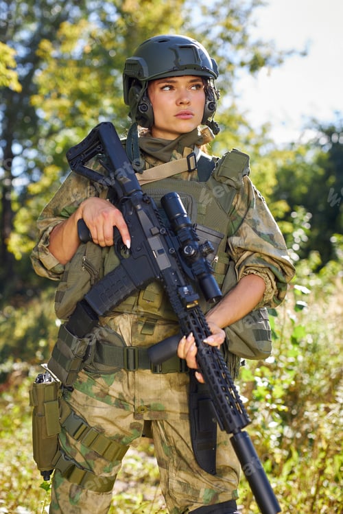 Preview: Strong Brave Female Army Soldier With Rifle Machine Gun Standing In The Forest, She Is Ready To