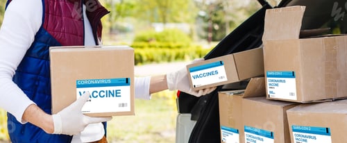 Preview: The Man Delivers The Vaccine. Placing Vaccine Label On The Cardboard Box