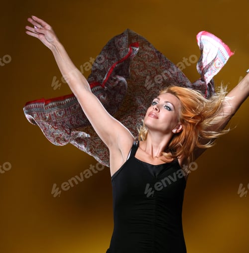 Preview: Beautiful Young Woman With A Scarf In The Wind . On A Yellow Background. Active Model