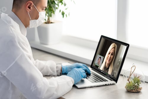 Preview: Doctor Having Video Conference On Laptop With Colleagues