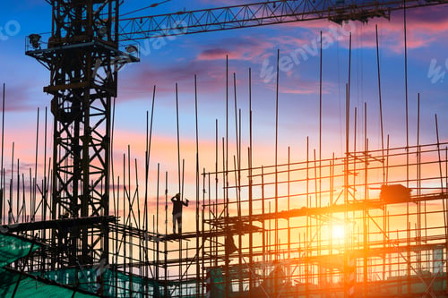 Preview: Construction Site With Crane And Workers At Sunset
