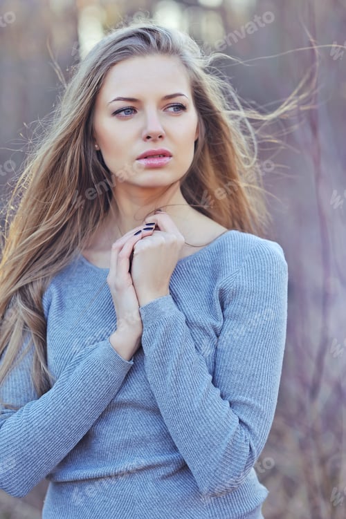 Preview: Beautiful Woman With Long Blond Hair. Close Up Portrait Of A Fashion Model Posing Outdoor