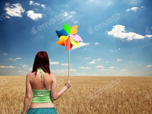 Preview: Girl With Wind Turbine At Wheat Field