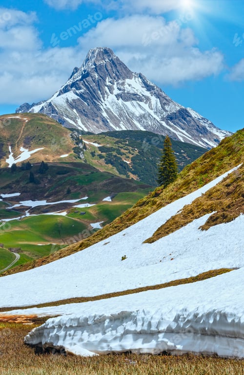 Preview: Summer Mountain View To Biberkopf Mount, Snow Thawing Meadow, And Sunshine In Blue Sky (Warth