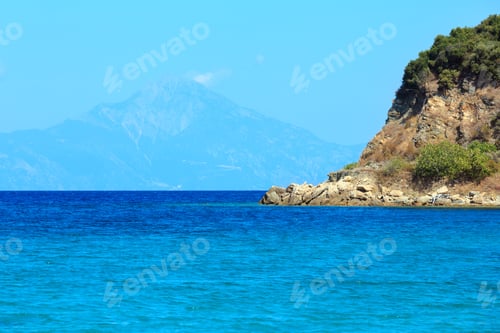 Preview: Aegean Sea Coast Landscape With Aquamarine Water And Mount Athos In Mist(Chalkidiki, Greece).
