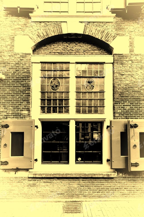 Preview: Stained Glass Window Of The Traditional House In Amsterdam. Red Brick Facade Of The Old City House