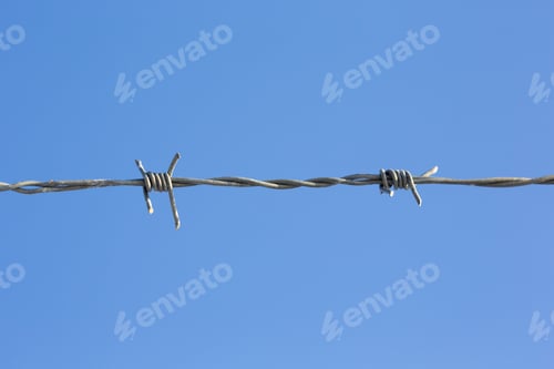Preview: Barb Wire Against A Blue Sky.