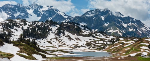 Preview: Summer Alps Mountain View To Small Kalbelesee Lake At Hochtannbergpass And Snow Thawing Meadow