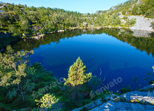 Preview: Deep Blue Small Mountain Norway Lake With Rocky Shore