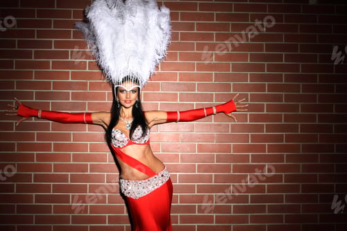 Preview: Beautiful Woman In Red Carnival Costume With Large Fluffy White Feathers