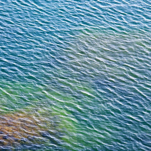 Preview: Transparent Coastal Azure Water Surface With Some Stones On Bottom