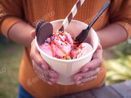 Preview: Closeup Of Woman'S Hands Holding Cup With Sweet Dessert Thai Ice Cream Made From Strawberry And