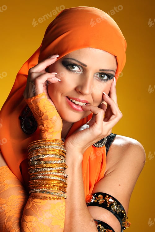 Preview: Beautiful Woman Dancing In Colorful Arabic Dance Costume.Girl In An Orange Dress. Beautiful