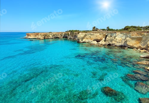 Preview: Picturesque Sunshiny Seascape With Cliffs, Rocky Arch And Stacks (Faraglioni), At Torre Sant