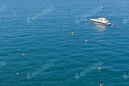 Preview: Colored Buoys Floating In Port Of Malta For Mooring Of Yachts. A Lonely Boat In An Empty Marina